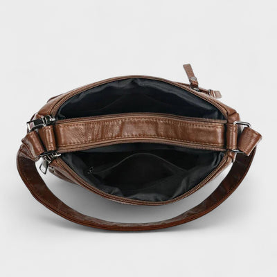 Nora. – Borsa a tracolla multilivello ispirata al vintage