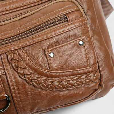 Nora. – Borsa a tracolla multilivello ispirata al vintage