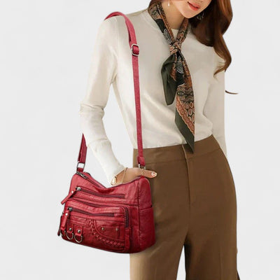 Nora. – Borsa a tracolla multilivello ispirata al vintage