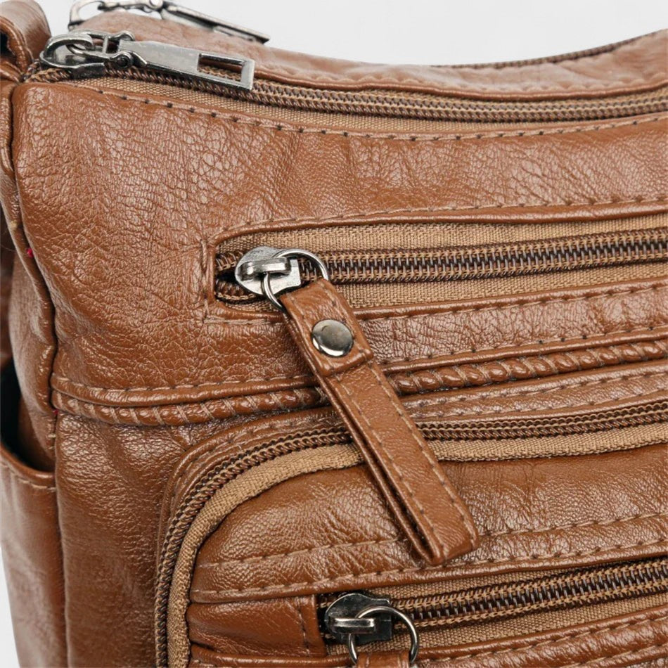 Nora. – Borsa a tracolla multilivello ispirata al vintage