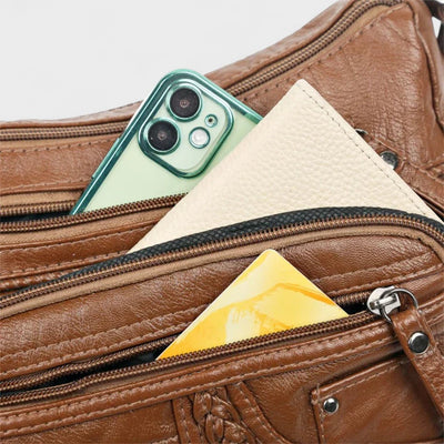 Nora. – Borsa a tracolla multilivello ispirata al vintage
