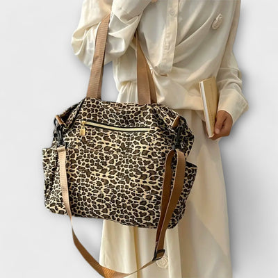 Nora. - Borsa a tracolla in tela con motivo leopardato